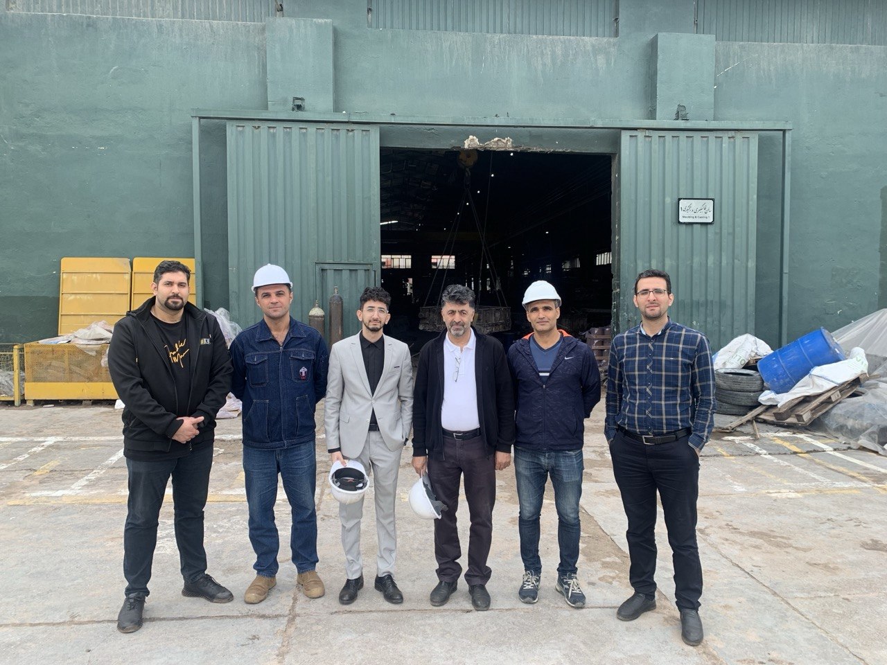 Meeting with manufacturing partners during an industrial site visit